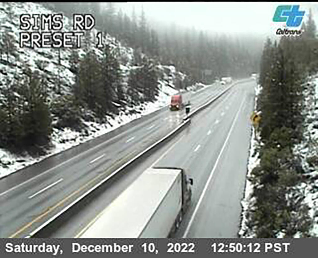 This image from a Caltrans traffic camera shows snow conditions on California Interstate 5 Sims Road in Shasta-Trinity National Forest, near Castella, Calif., on Saturday, Dec. 10, 2022. A stretch of California Highway 89 was closed due to heavy snow between Tahoe City and South Lake Tahoe, Cali., the highway patrol said. Interstate 80 between Reno and Sacramento remained open but chains were required on tires for most vehicles. (Caltrans via AP)