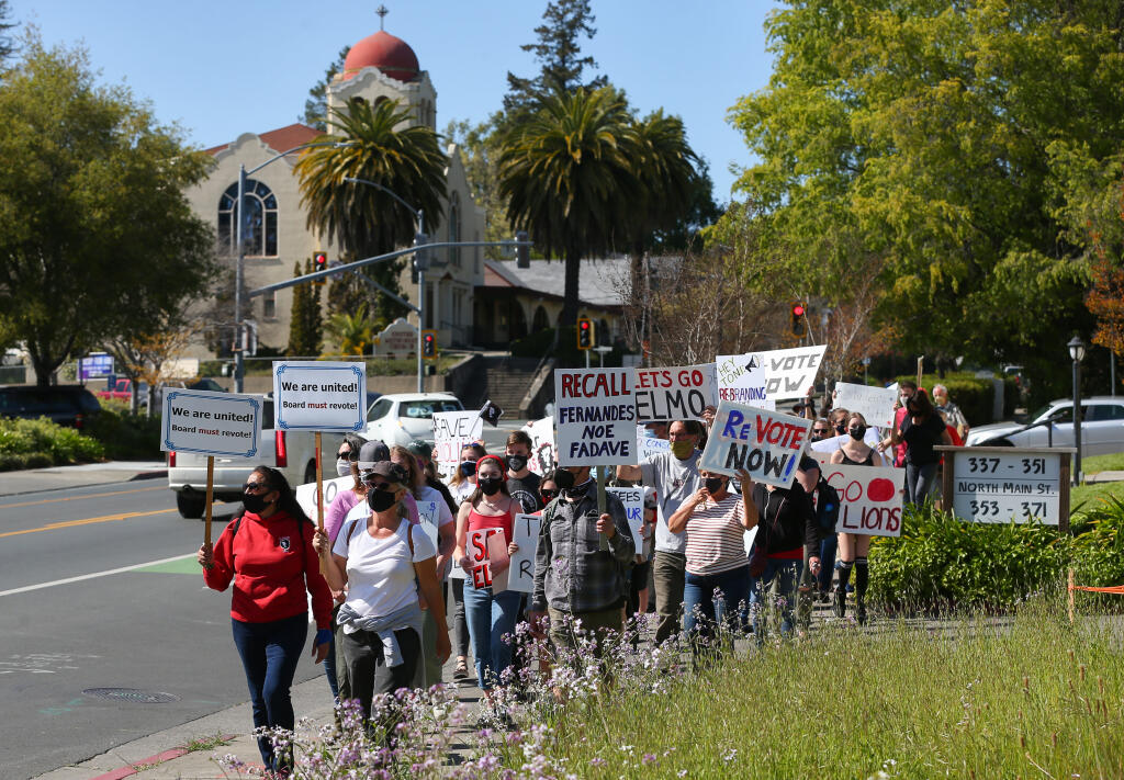 Opponents to the consolidation of West Sonoma County schools march along North Main Street in Sebastopol on Thursday, April 8, 2021. (Christopher Chung/ The Press Democrat)