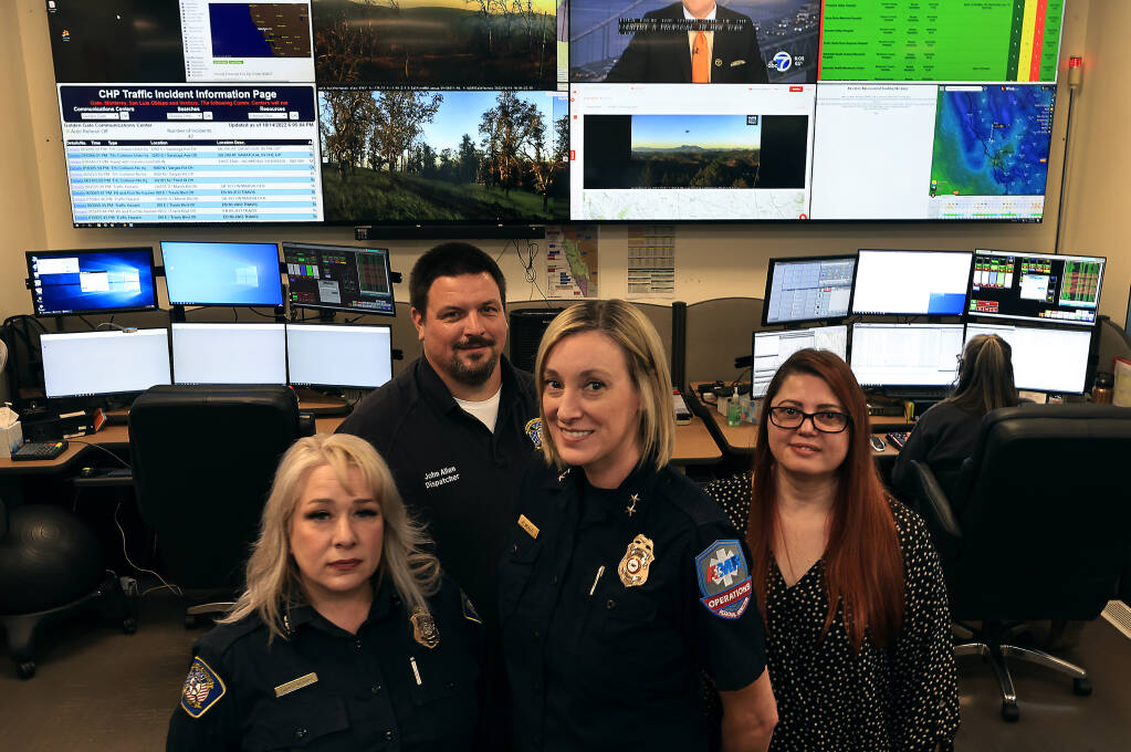 From left, Evonne Stevens, John Allen, KT McNulty and Calista Pimentel were all on the Redcom dispatch floor the night the 2017 Tubbs Fire broke out in Santa Rosa. Photo taken Friday, Oct. 14, 2022. (Kent Porter/The Press Democrat)