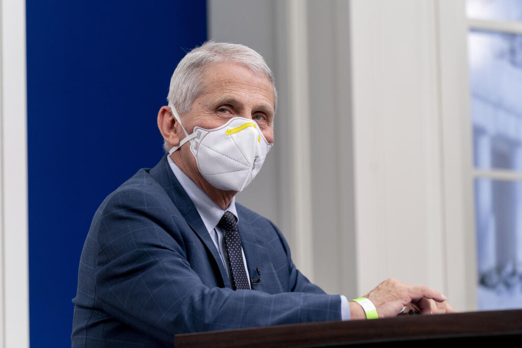 Dr. Anthony Fauci, director of the National Institute of Allergy and Infectious Diseases and chief medical adviser to the president, meets with the White House COVID-19 Response Team on the latest developments related to the Omicron variant in the South Court Auditorium in the Eisenhower Executive Office Building on the White House Campus in Washington, Tuesday, Jan. 4, 2022. (AP Photo/Andrew Harnik)