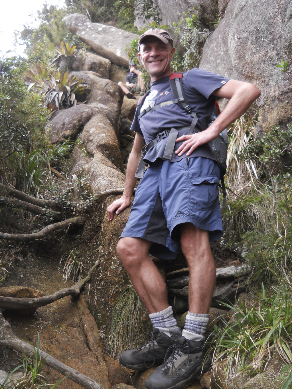 In this photo provided by Tom Hennigan, British Journalist Dom Phillips poses for a photo during a hike in Serra dos Orgaos National Park, in Petropolis, Brazil, Aug. 2013. British journalist Dom Phillips’ quest to unlock the secrets of how to preserve Brazil’s Amazon was cut short this June 2022, when he was killed along with a colleague in the heart of the forest he so cherished. (Tom Hennigan via AP)