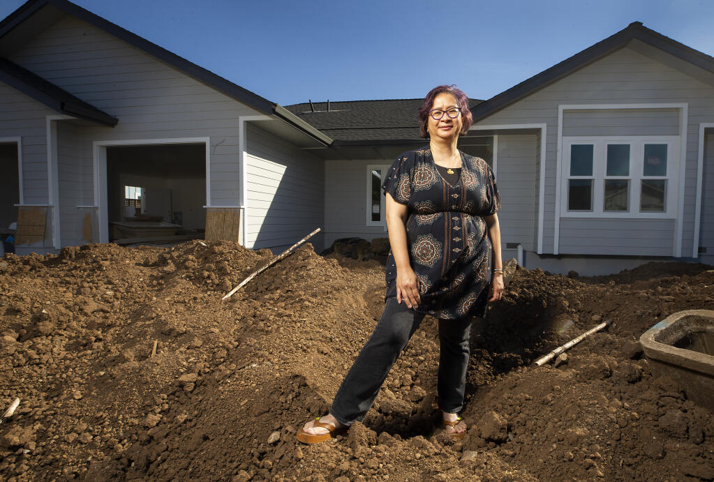 Block captain Vita Iskandar started a website to help other fire survivors cope with insurance companies and other hurdles. Iskandar is shown on the property where she lost her Hidden Valley home in the Tubbs fire on Friday, Sept. 25, 2020. (John Burgess / The Press Democrat)