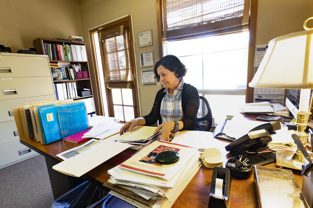 National Alliance on Mental Illness Sonoma County Executive Director Mary-Frances Walsh works in their Santa Rosa office July 15, 2022. (John Burgess / The Press Democrat)