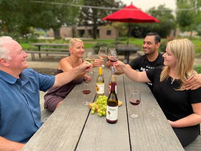 Visitors to Barra of Mendocino in Mendocino County’s Redwood Valley taste wine in the outdoor seating in early June. (courtesy of Barra of Mendocino)