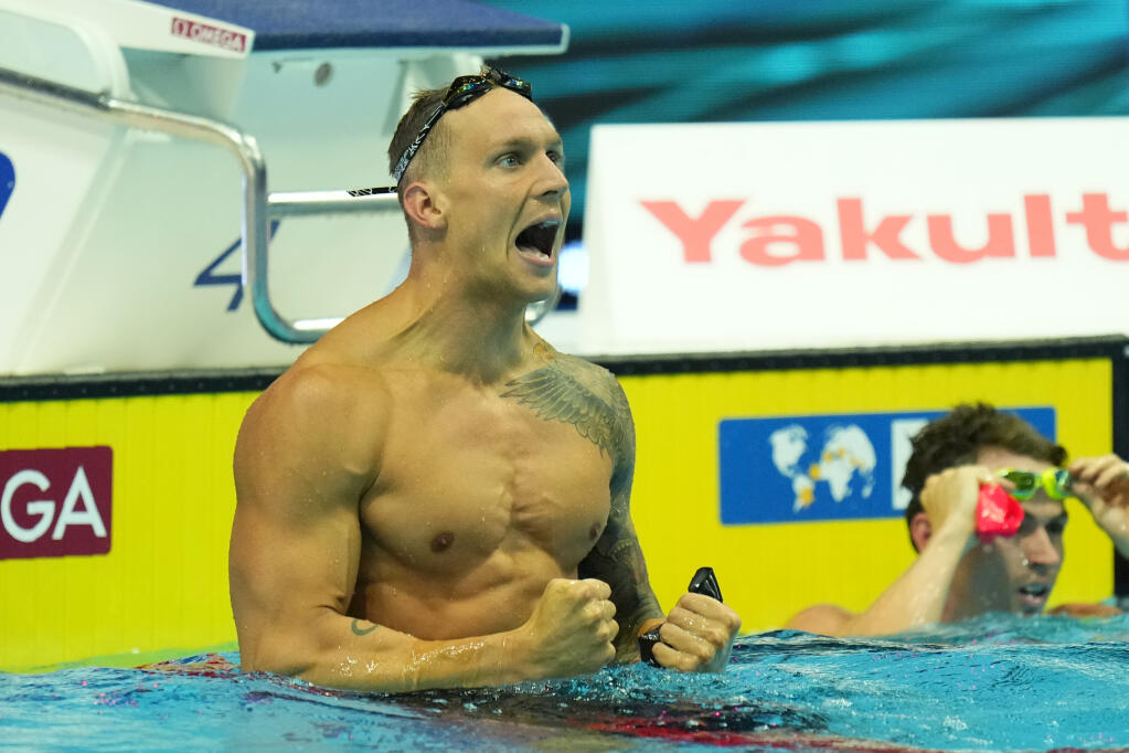 Caeleb Dressel of the United States celebrates after winning the Men 50m Butterfly final at the 19th FINA World Championships in Budapest, Hungary, Sunday, June 19, 2022. (AP Photo/Petr David Josek)