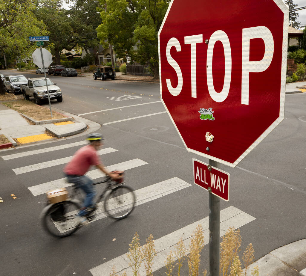 Bicyclists along the Humboldt Street bicycle boulevard in Santa Rosa still have to stop at this intersection now that Gov. Gavin Newson vetoed a bill to legalize "Idaho stops."  Idaho stops are when cyclists decelerate but do not fully stop at stop signs, unless there is traffic.  (John Burgess / The Press Democrat)