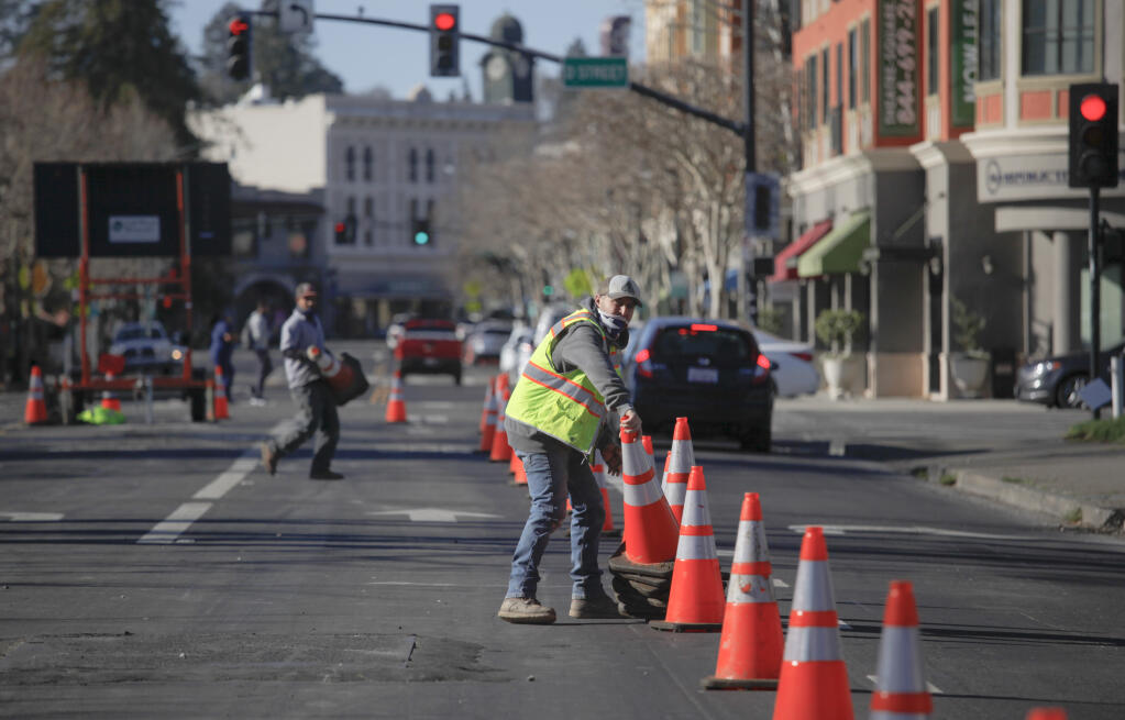 A crew works on patching up the road at Petaluma Boulevard and D Street in this January 2021 file photo. This year Petaluma hopes to see more funds spent on road repairs since the new 1-cent sales tax was passed.(CRISSY PASCUAL/ARGUS-COURIER STAFF)