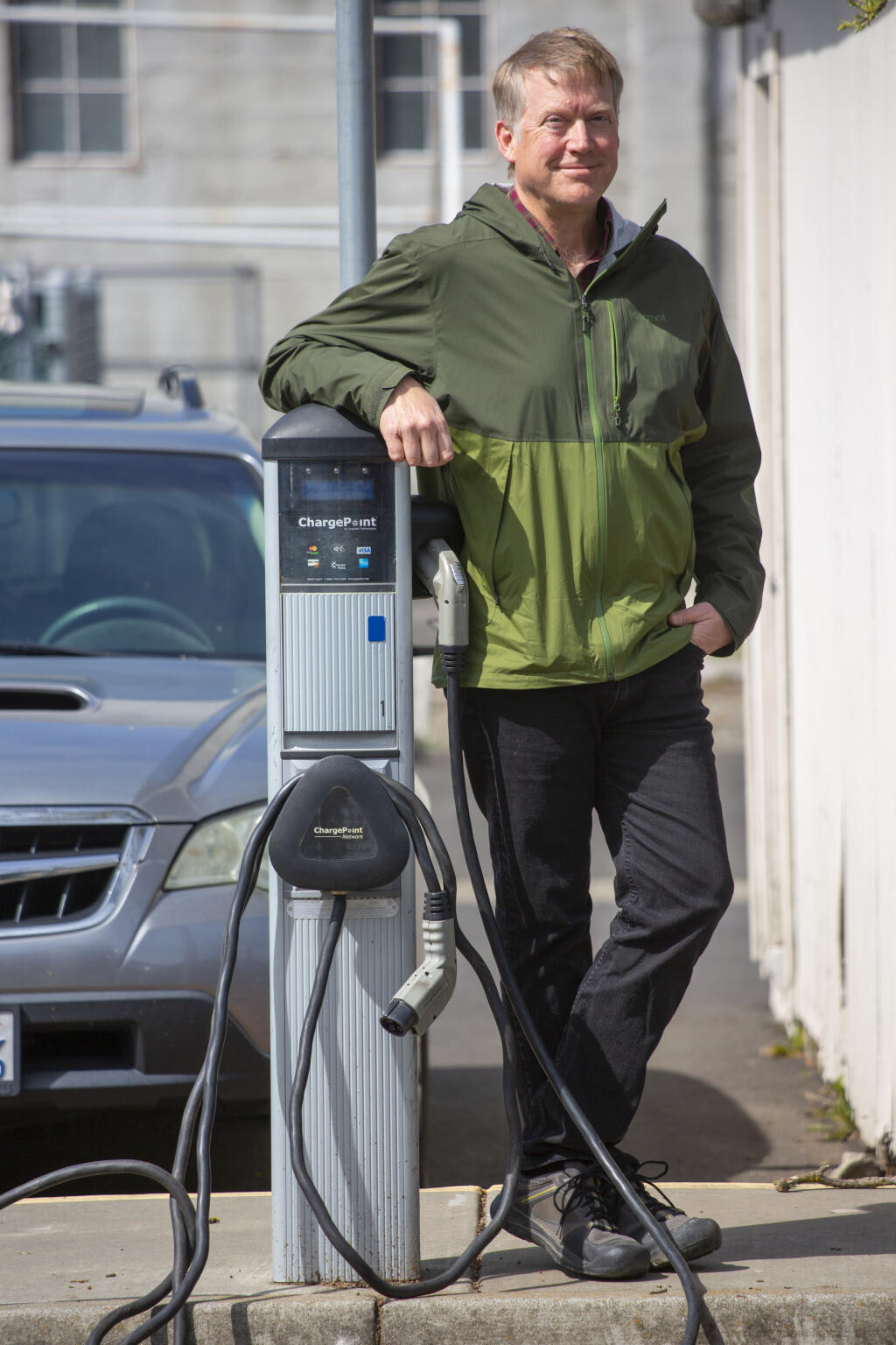 Travis Wagner, the sustainability coordinator for the city of Sonoma, with the EV chargers in the public parking lot off of East Napa Street on Monday, March 22, 2021. (Photo by Robbi Pengelly/Index-Tribune)