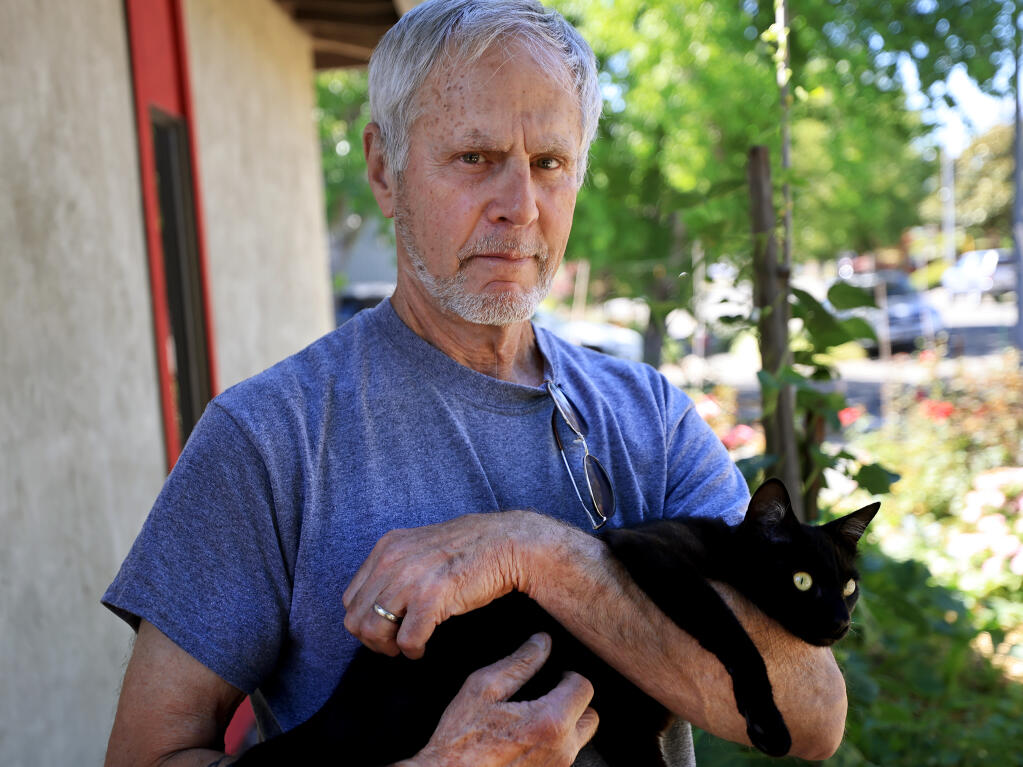 Glen Martin and his cat, Mo, of Santa Rosa, Wednesday, June 23, 2021. (Kent Porter / The Press Democrat) 2021