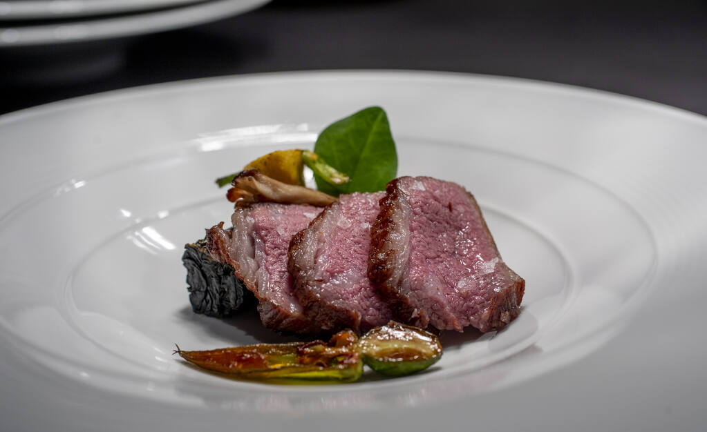Beef, squash and maitake are plated for service during a family and friends pre-opening at Cyrus in Geyserville on Sept. 8, 2022. (Chad Surmick / The Press Democrat)