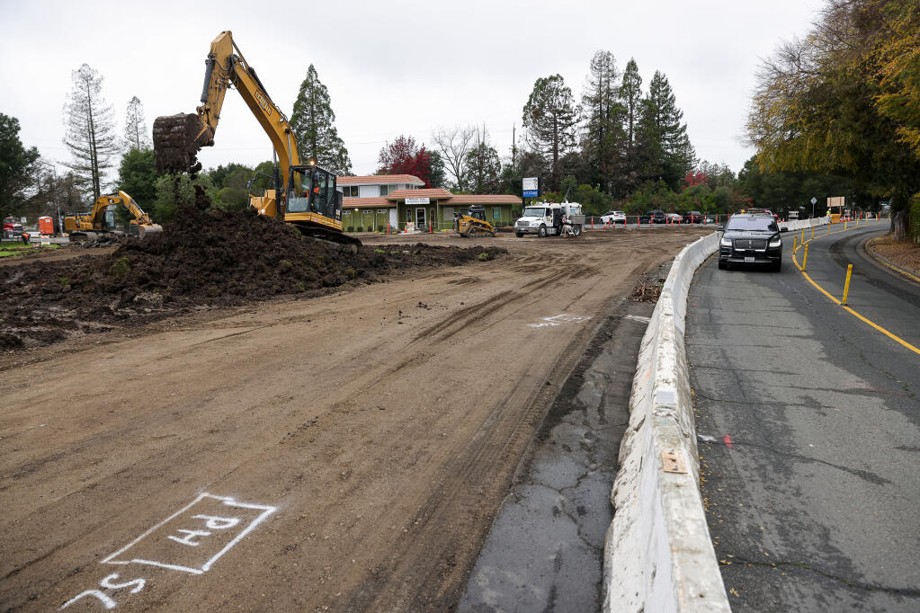 A construction crew works building a roundabout at the junction of Commerce Boulevard and Southwest Boulevard in Rohnert Park on Thursday, January 6, 2022.  (Christopher Chung/ The Press Democrat)