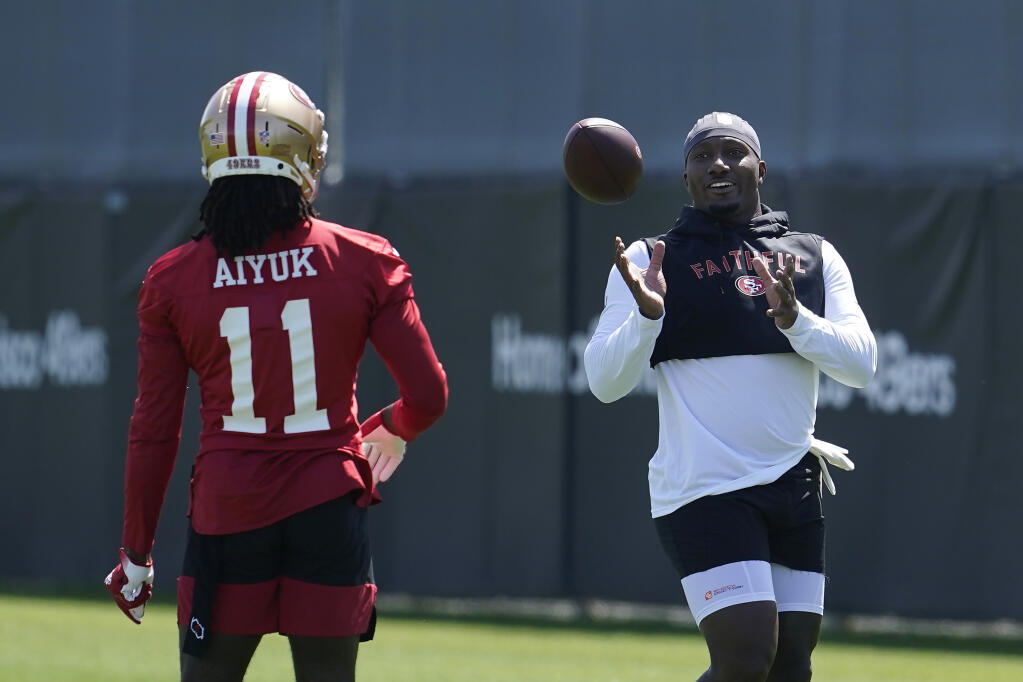 San Francisco 49ers wide receiver Deebo Samuel, right, smiles next to wide receiver Brandon Aiyuk at the team’s practice facility in Santa Clara on Tuesday, June 7, 2022. (Jeff Chiu / ASSOCIATED PRESS)