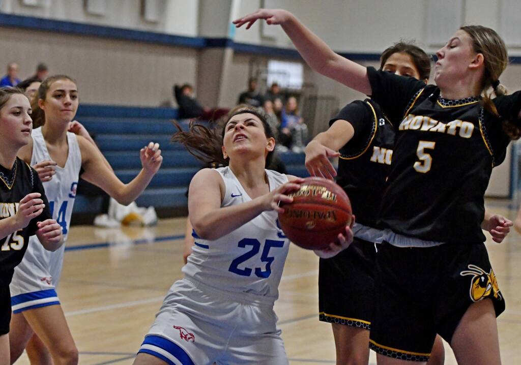 Nedine Ghattas takes the ball to the hoop for St. Vincent in a game against Novato. (Sumner Fowler / For the Argus-Courier)