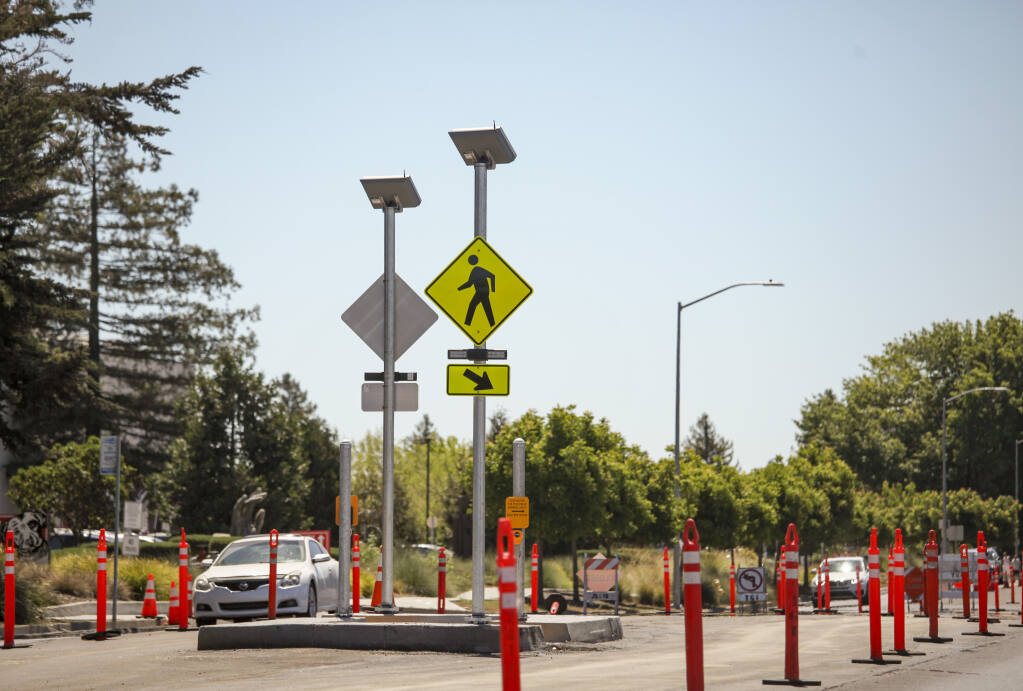A new pedestrian crosswalk on North McDowell Boulevard near Lagunitas undergoes construction on Tuesday, July 25, 2023. (CRISSY PASCUAL/ARGUS-COURIER STAFF)