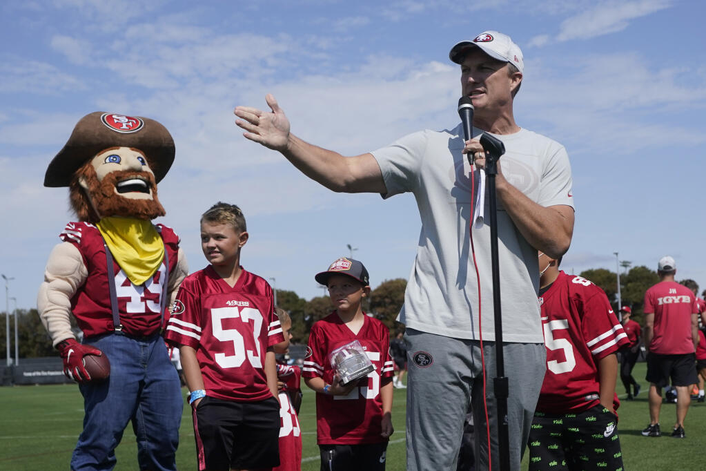 San Francisco 49ers general manager John Lynch, foreground, addresses fans during training camp on Saturday, July 30, 2022, in Santa Clara. (Jeff Chiu / ASSOCIATED PRESS)