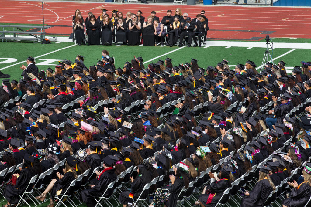 Students seated Saturday, May 28, 2022, at Santa Rosa Junior College’s Bailey Field listen to speeches during the Santa Rosa Junior College Commencement program. (Darryl Bush / For The Press Democrat)