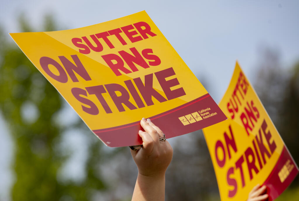Sutter nurses protest low staffing levels outside the Santa Rosa campus along Mark West Springs Road Monday April 18, 2021 (Chad Surmick / The Press Democrat)