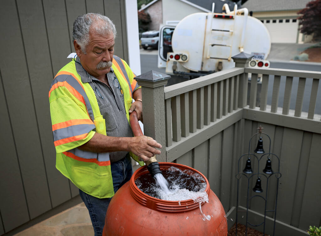 Jo Jo Garcia contracts with city of Healdsburg, Wednesday, June 23, 2021, to haul tertiary treated water to fill water tanks for Healdsburg home owners.  The water is used to water outdoor vegetation due to the drought.  (Kent Porter / The Press Democrat)