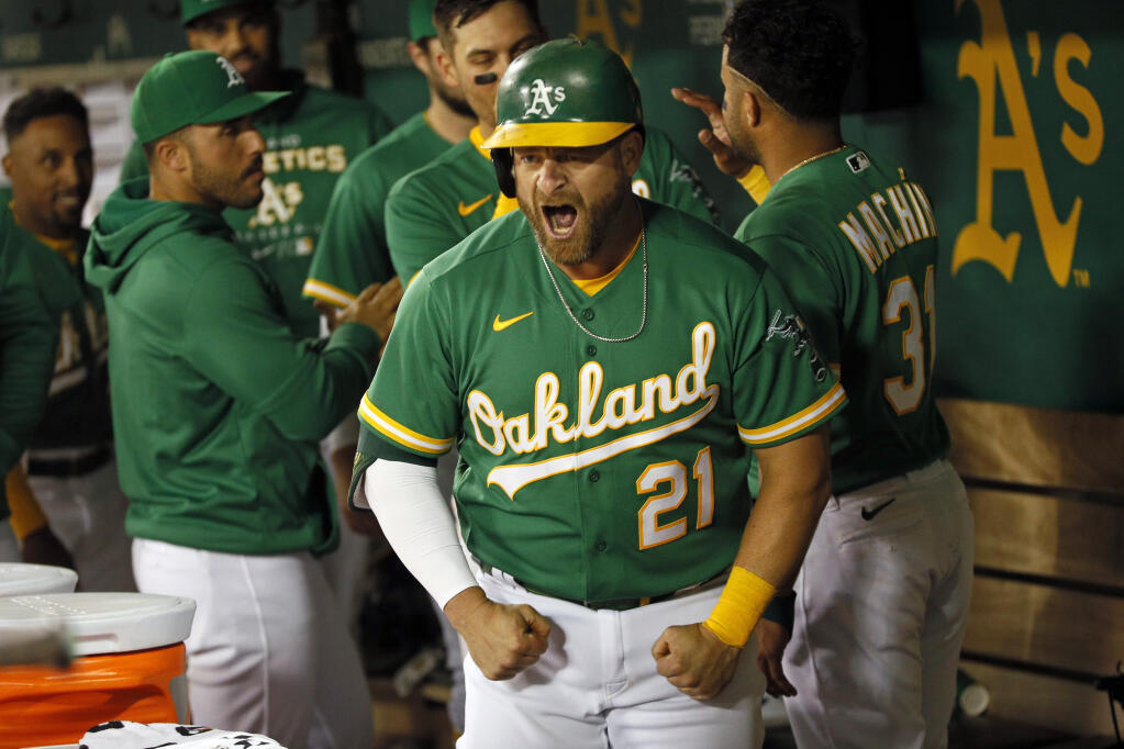 The Athletics’ Stephen Vogt reacts after hitting a two-run home run in the 10th inning against the New York Yankees Saturday, Aug. 27, 2022, in Oakland. (Santiago Mejia / San Francisco Chronicle)