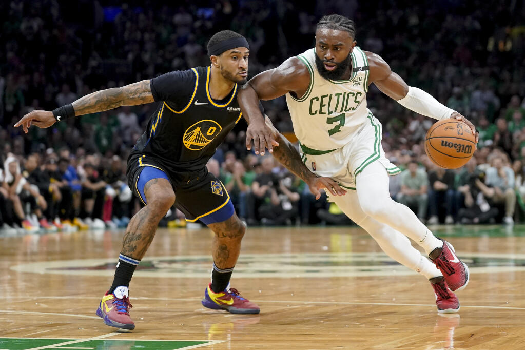 Boston Celtics guard Jaylen Brown (7) drives against Golden State Warriors guard Gary Payton II (0) during the first quarter of Game 3 of basketball's NBA Finals, Wednesday, June 8, 2022, in Boston. (AP Photo/Steven Senne)