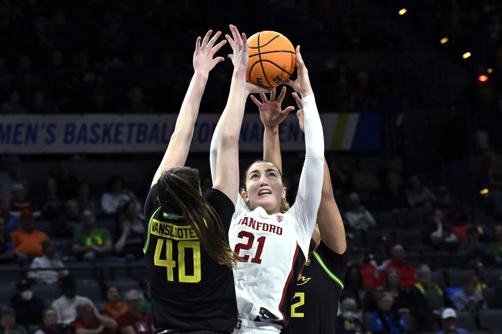 Stanford forward Brooke Demetre reaches for the ball between Oregon forward Grace VanSlooten, left, and guard Te-Hina Paopao during the second half of Thursday’s Pac-12 women’s tournament quarterfinal game in Las Vegas. (David Becker / ASSOCIATED PRESS)