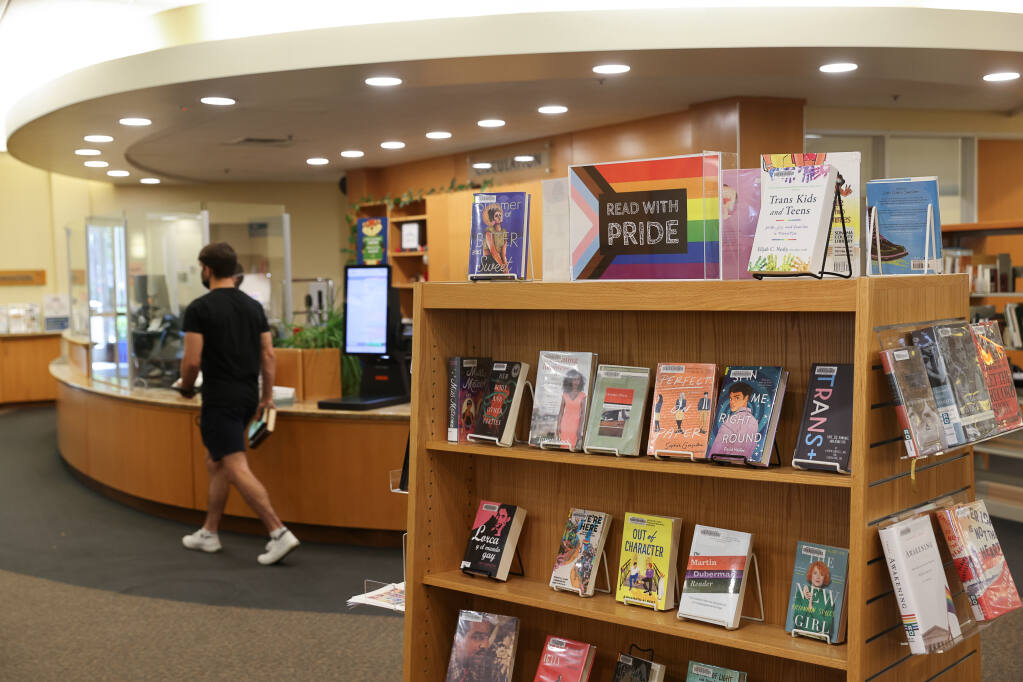 The Pride-themed book display at the Rohnert Park-Cotati Regional Library in Rohnert Park on Wednesday, June 22, 2022.  (Christopher Chung/The Press Democrat)