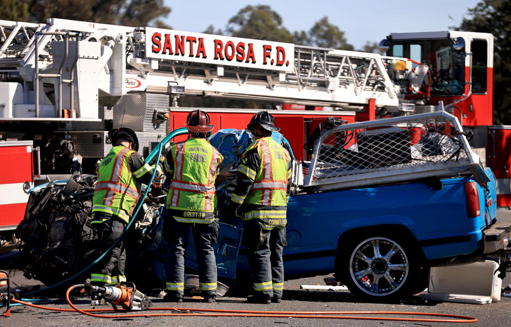 Santa Rosa firefighters extricate a victim of a fatal crash on Highway 12 near Llano Road, Wednesday, Sept. 29, 2021.  (Kent Porter / The Press Democrat) 2021