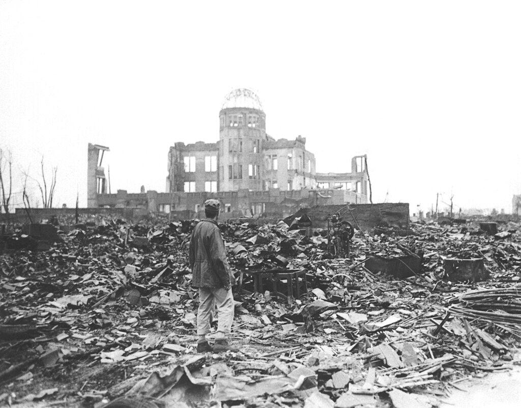 FILE - An Allied war correspondent stands in the ruins of Hiroshima, Japan, weeks after the city was leveled by an atomic bomb. (Associated Press)