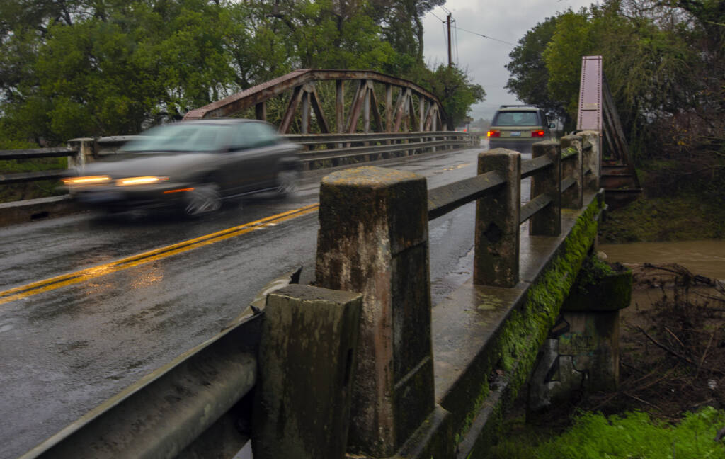 Historic Watmaugh Bridge, scheduled to be replaced starting in 2024-25, amid the rains on Wednesday, Jan. 11. (Robbi Pengelly/Index-Tribune)