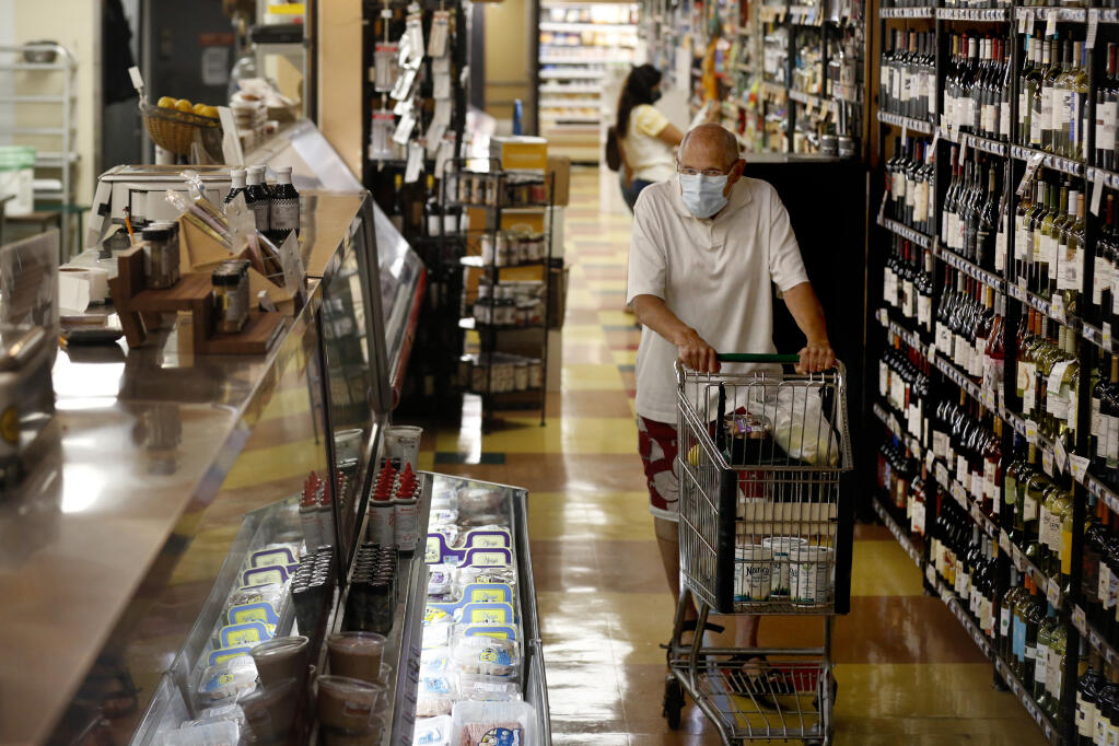 Serge Zimberoff shops for groceries at Pacific Market in Santa Rosa, California, on Monday, Aug. 10, 2020. (Beth Schlanker/The Press Democrat)