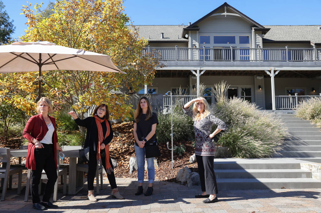 Compass broker/realtors Kate Gomes, left, and Ann Amtower show a home to Tonya Masino and Sotheby's broker associate Carole Sauers in Healdsburg on Thursday, Oct. 28, 2021. (Christopher Chung / The Press Democrat)