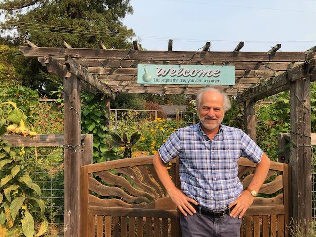 Food For Thought Executive Director Ron Karp stands in front of the organization’s organic garden. Photo provided.