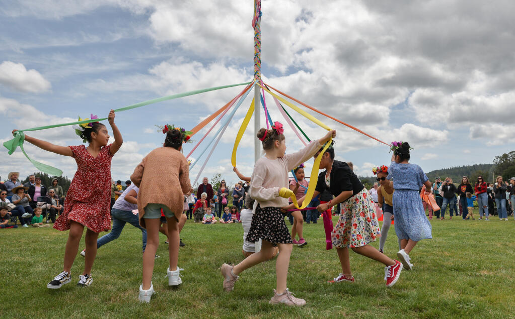 Students from Geyserville Elementary School perform a Maypole dance during the Geyserville May Day celebration on Sunday, May 7, 2023.  (Christopher Chung/The Press Democrat)