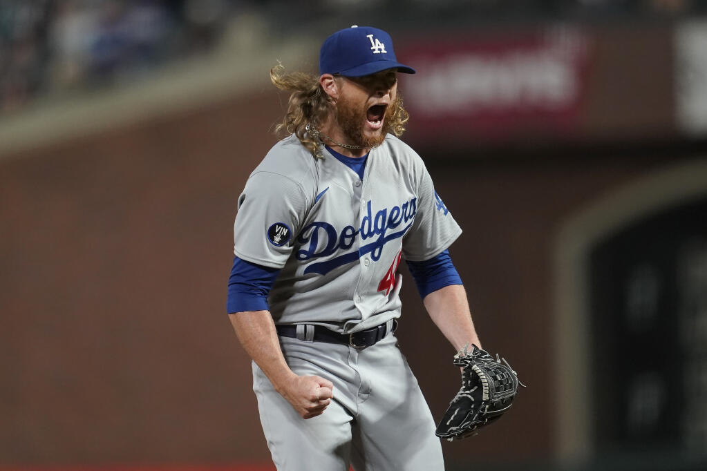 Los Angeles Dodgers pitcher Craig Kimbrel reacts after striking out the Giants’ Austin Slater to end the game in San Francisco, Wednesday, Aug. 3, 2022. (AP Photo/Jeff Chiu)