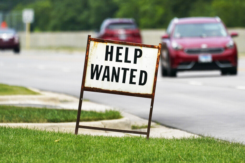 FILE - A help wanted sign is displayed at a gas station in Mount Prospect, Ill., Tuesday, July 27, 2021. Initial unemployment claims decreased by 5,000 to 232,000 in the week ended Aug. 27, 2022, the Labor Department reported Thursday. (AP Photo/Nam Y. Huh)