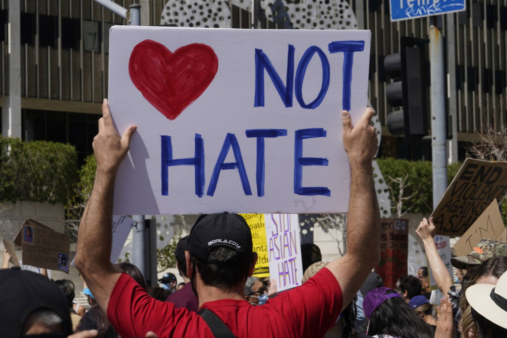 Demonstrators rally against Asian hate crimes on March 27, 2021, in downtown Los Angeles. (AP Photo/Damian Dovarganes, File)