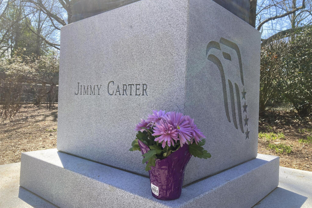 Flowers are shown on the grounds of the Carter Center in Atlanta, Sunday, Feb. 19, 2023. Well-wishes and fond remembrances for former President Jimmy Carter were pouring in a day after he entered hospice care at his home in Georgia. (AP Photo/Jeff Martin)