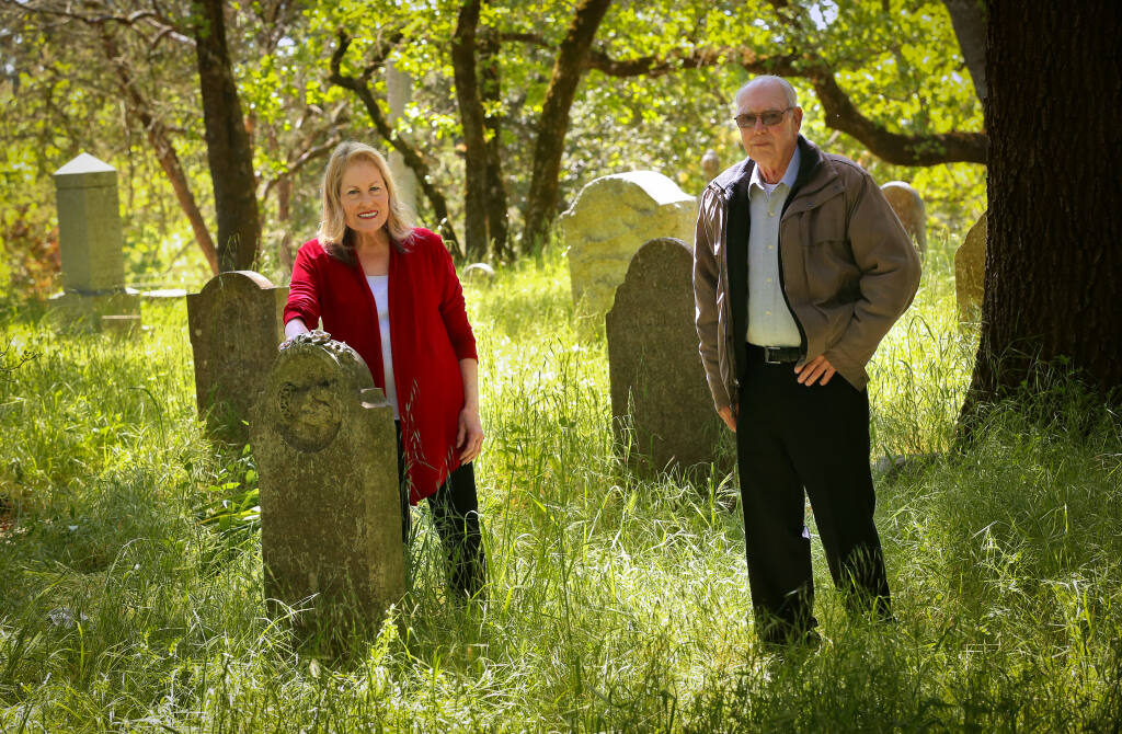 Sandy Frary, left, and Raymond Owen spent about 13 years compiling information on the lives and deaths and stories of the people buried at the Santa Rosa Rural Cemetery. (Christopher Chung/ The Press Democrat)