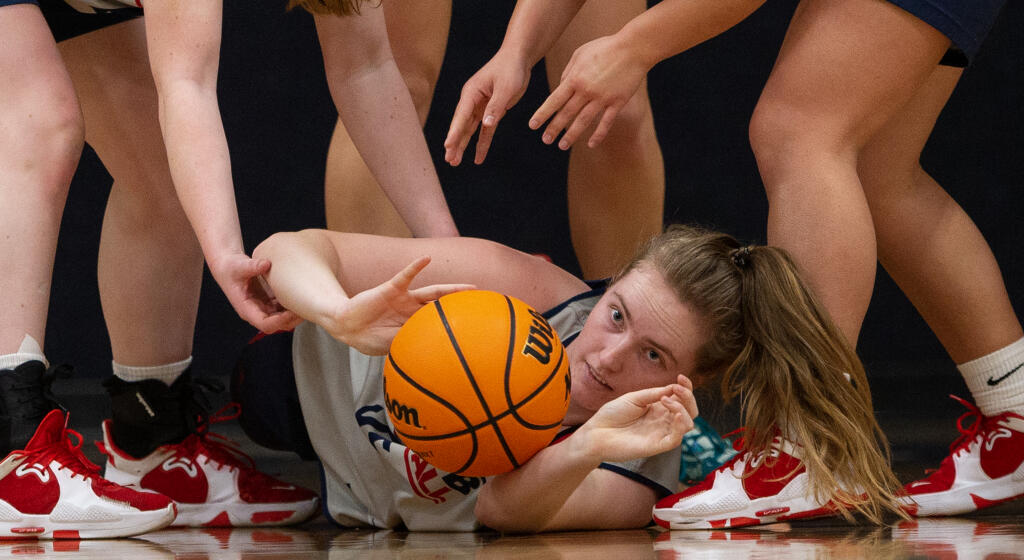 Santa Rosa Junior College’s Rose Nevin pushes a loose ball out of a scramble for a rebound during practice Thursday, Feb. 2, 2023 at Haehl Pavilion. (Chad Surmick / The Press Democrat)