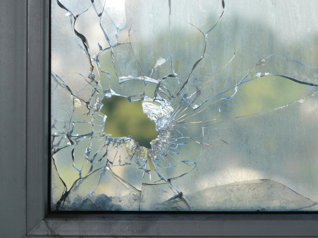 A fight among friends and a broken window left one with a gash on his arm. (Shutterstock).