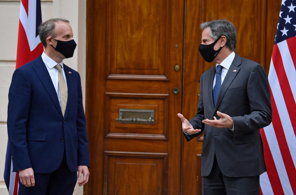 Britain's Foreign Secretary Dominic Raab, left, poses for a photo with U.S. Secretary of State Antony Blinken ahead of bilateral talks as part of the G7 foreign ministers meeting near London, Monday May 3, 2021.  Issues related to Iran are set to feature in talks later Monday between U.S. Secretary of State Antony Blinken and his host in London, British Foreign Secretary Dominic Raab. (Ben Stansall / Pool via AP)