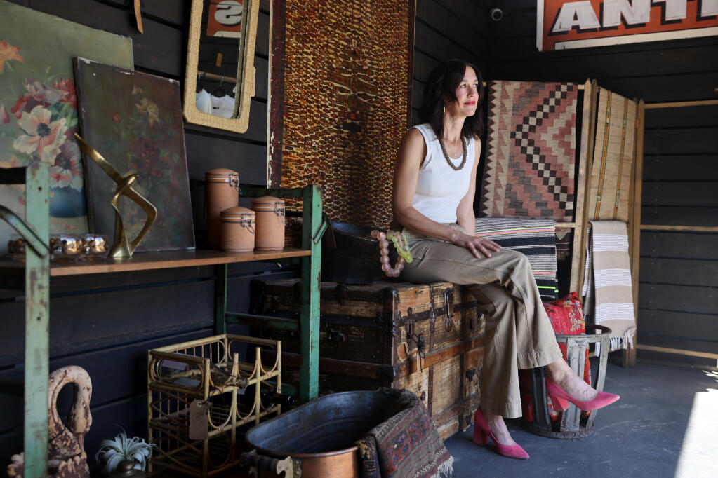 Kelly Dorrance, the co-owner of Reeve Wines and BloodRoot Wines, at The Stand antique shop in Healdsburg, Calif. on Tuesday, Sept. 13, 2022. (Beth Schlanker/The Press Democrat)