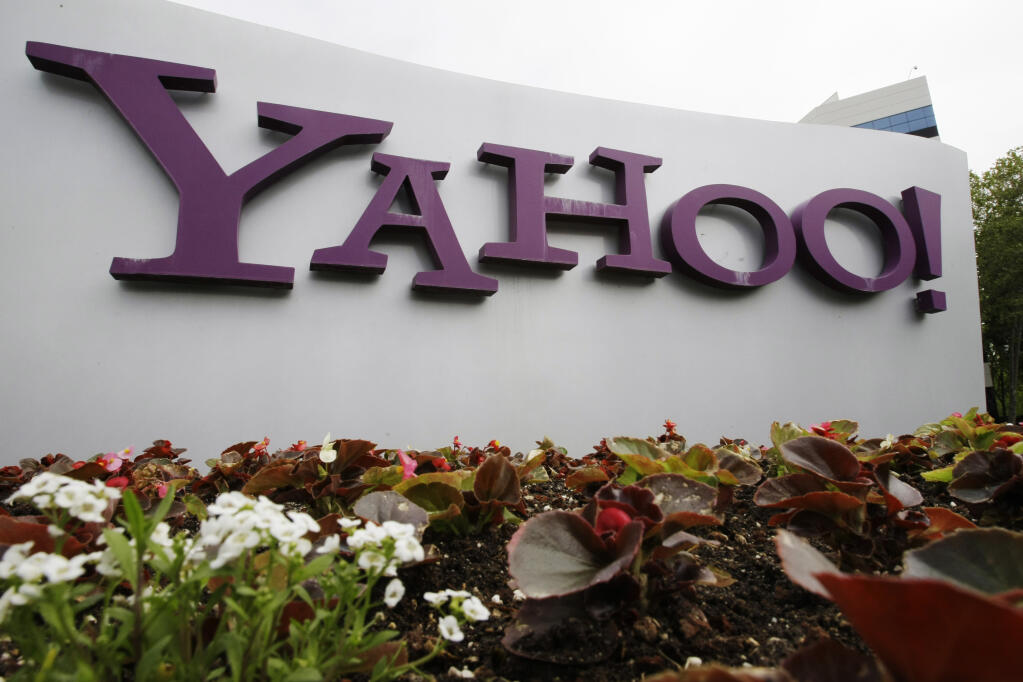 FILE - The Yahoo logo is displayed outside of offices in Santa Clara, Calif., in this Monday, April 18, 2011, file photo. Verizon is selling the segment of its business that includes Yahoo and AOL to private equity firm Apollo Global Management in a $5 billion deal. Verizon said Monday, May 3, 2021, that it will keep a 10% stake in the new company, which will be called Yahoo. (AP Photo/Paul Sakuma, File)