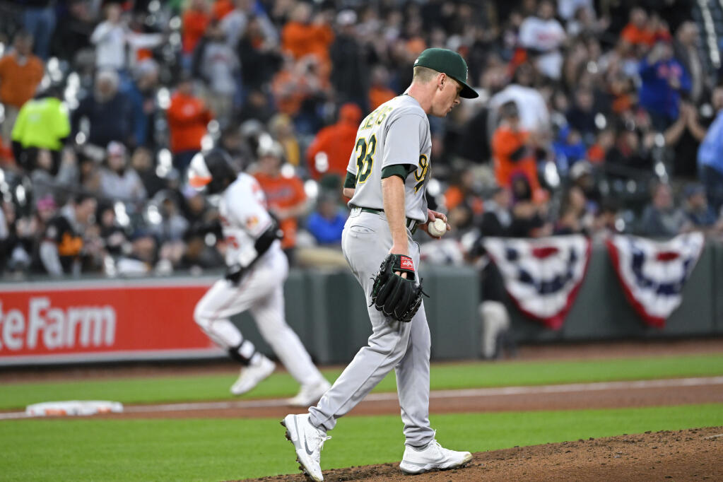 Oakland Athletics starting pitcher JP Sears (38) looks on after surrendering a solo home run to Baltimore Orioles' Adley Rutschman during the third inning of a baseball game, Monday, April 10, 2023, in Baltimore. (AP Photo/Terrance Williams)