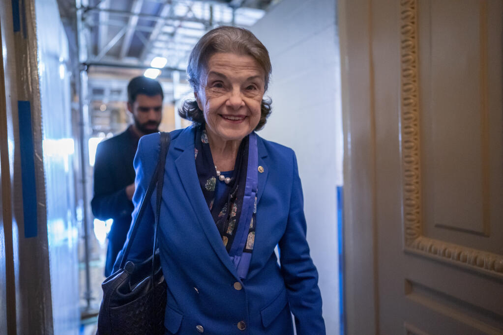 FILE - Sen. Dianne Feinstein, D-Calif., walks through a Senate corridor at the Capitol in Washington, Feb. 14, 2023. The oldest member of Congress has been hospitalized in San Francisco with a case of shingles. The 89-year-old Feinstein said in a statement on Thursday, March 2, she was diagnosed last month and is receiving treatment. (AP Photo/J. Scott Applewhite, File)