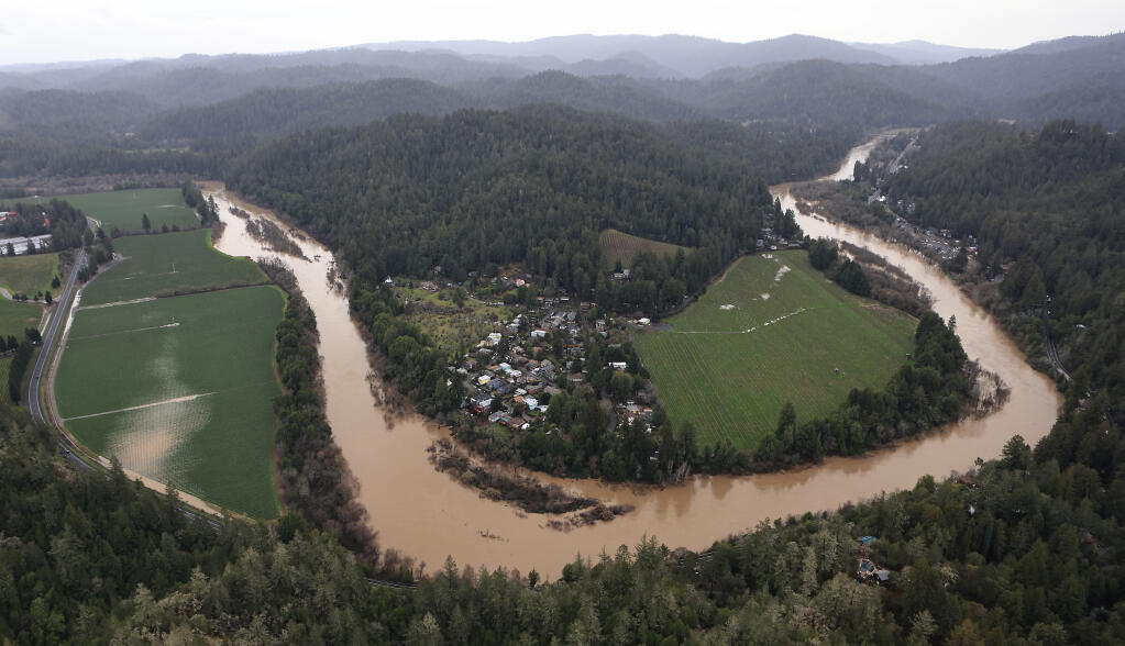 The Russian River at the Rio Nido bend, Korbel Winery on the left and Guerneville top right, Sunday, Jan. 8, 2023. (Kent Porter/The Press Democrat)