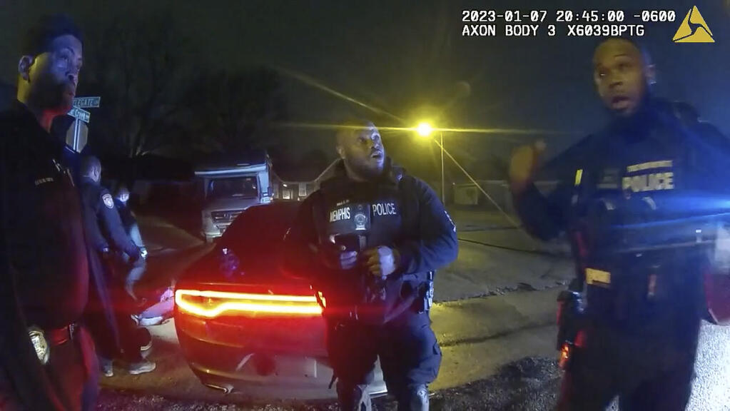 The image from video released on Jan. 27, 2023, by the City of Memphis, shows police officers talking after a brutal attack on Tyre Nichols by five Memphis police officers on Jan. 7, 2023, in Memphis, Tenn. Nichols died on Jan. 10. The five officers have since been fired and charged with second-degree murder and other offenses. (City of Memphis via AP)