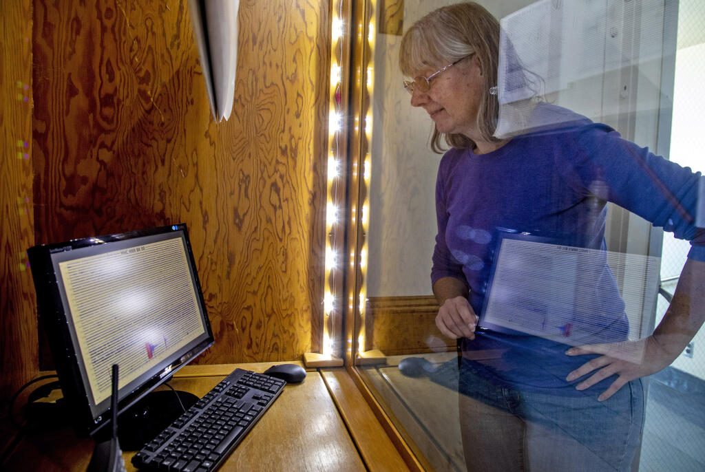 Astronomer Elinor Gates looks at a seismograph report after experiencing a magnitude 5.1 earthquake, Tuesday, Oct. 25, 2022, at Lick Observatory atop Mount Hamilton east of San Jose, Calif. (Karl Mondon/Bay Area News Group via AP)