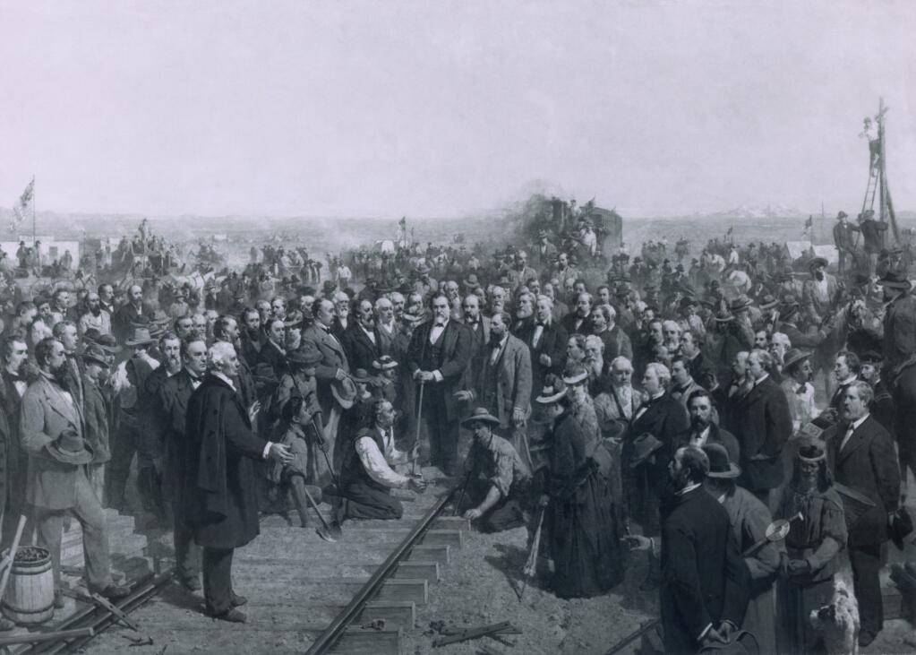 THE LAST SPIKE - 1881 a painting by Thomas Hill depicts the ceremony held at Promontory Point Utah on May 10 1869 marking the completion of the transcontinental railroad. (From the Everett Collection/Shutterstock)