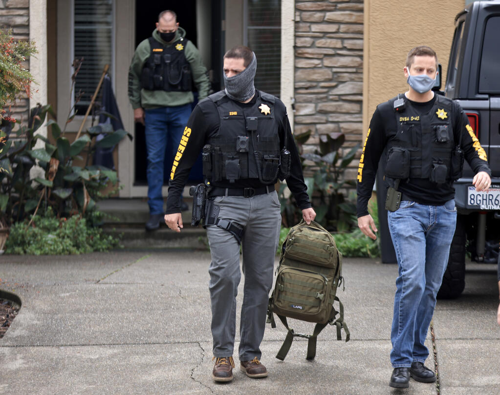 Detectives with the Sonoma County Sheriff's Department leave Dominic Foppoli's home in Windsora after serving a search warrant, Wednesday, Nov. 10, 2021. (Kent Porter / The Press Democrat)